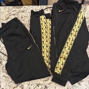 Nike women’s xs Black and Gold Track Pants
